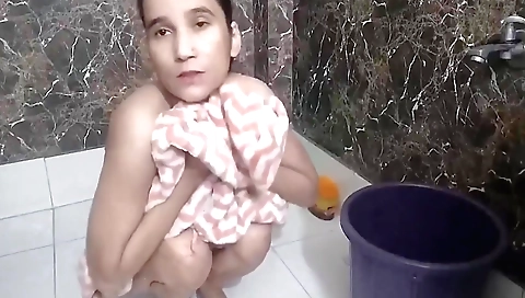 Indian solo female video with a shaved pussy in the bathroom