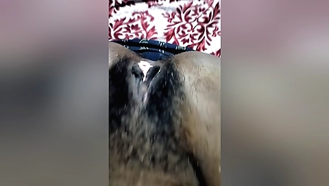 Indian hairy pussy video showing a woman with a hairy pussy
