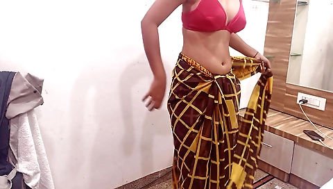 Amateur solo female in a sexy saree is in private studio