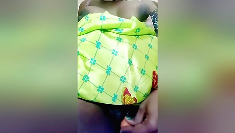 Indian girl wearing a red dress plays with a toy in amateur video