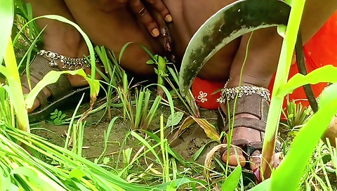 Indian in a sexy outfit rides in the field on her own