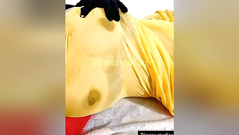 Indian woman is wearing a white blouse and is stripping