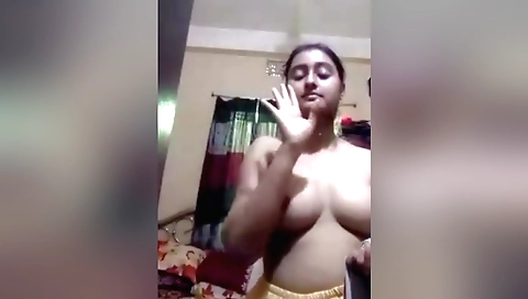 Blonde with small round boobs shows her face in the web camera