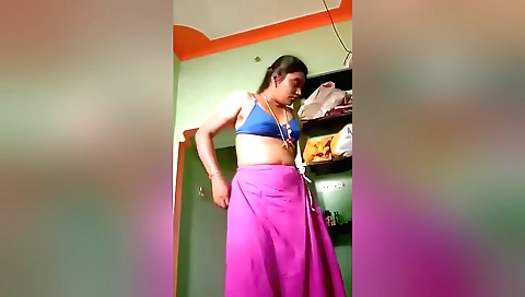 Indian brunette gives handjob on a camera and takes off a top