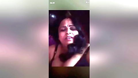 Busty brunette milf showing her hairy pussy and big tits