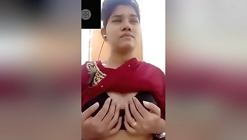 Busty brunette shows her pretty boobs on the webcam