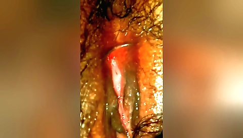 Cute amateur female is showing her hairy pussy in a video