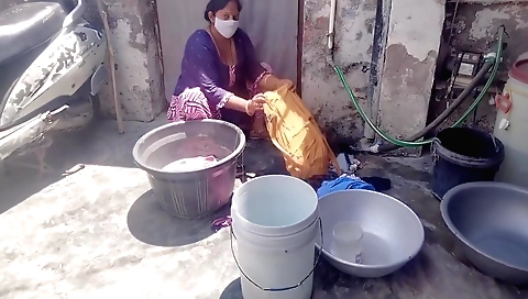Hot indian woman is washing clothes in the bedroom