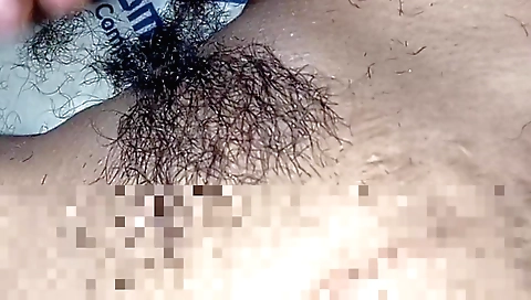 Indian babe gets on her knees to fuck her hairy pussy