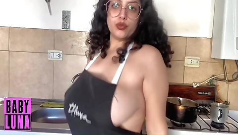 Solo amateur female with a sexy apron enjoys cooking