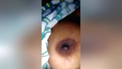 Indian girlfriend is alone in the bedroom taking it off
