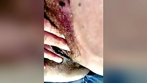 Indian brunette takes off a sexy bra and rubs her hairy pussy