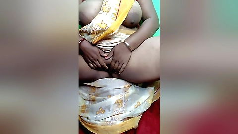Indian brunette is fingering and rubbing her pussy