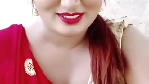 Sexy brunette beauty with big tits shows off her body