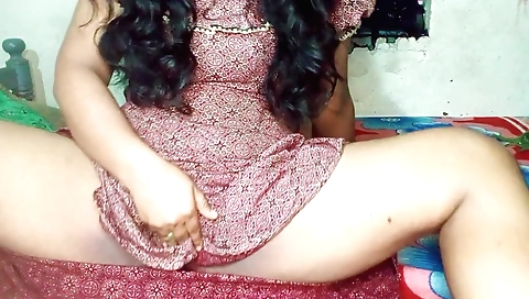 A brunette with a small body and tits is alone in her room