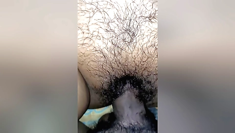 Indian wife with a hairy pussy makes love to herself