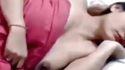 Indian brunette showing her boobs and ass in her outfit
